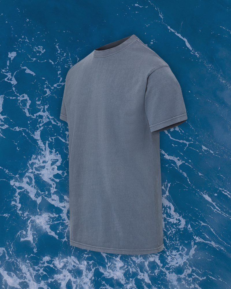 Close-up of a single green leaf against a white background.