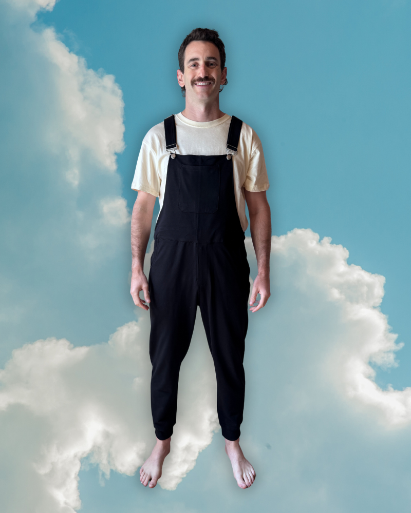 Close-up of a single green leaf against a white background.