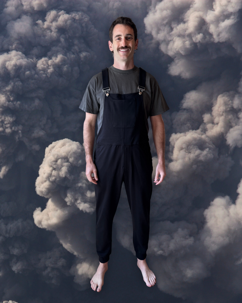 Close-up of a single green leaf against a white background.