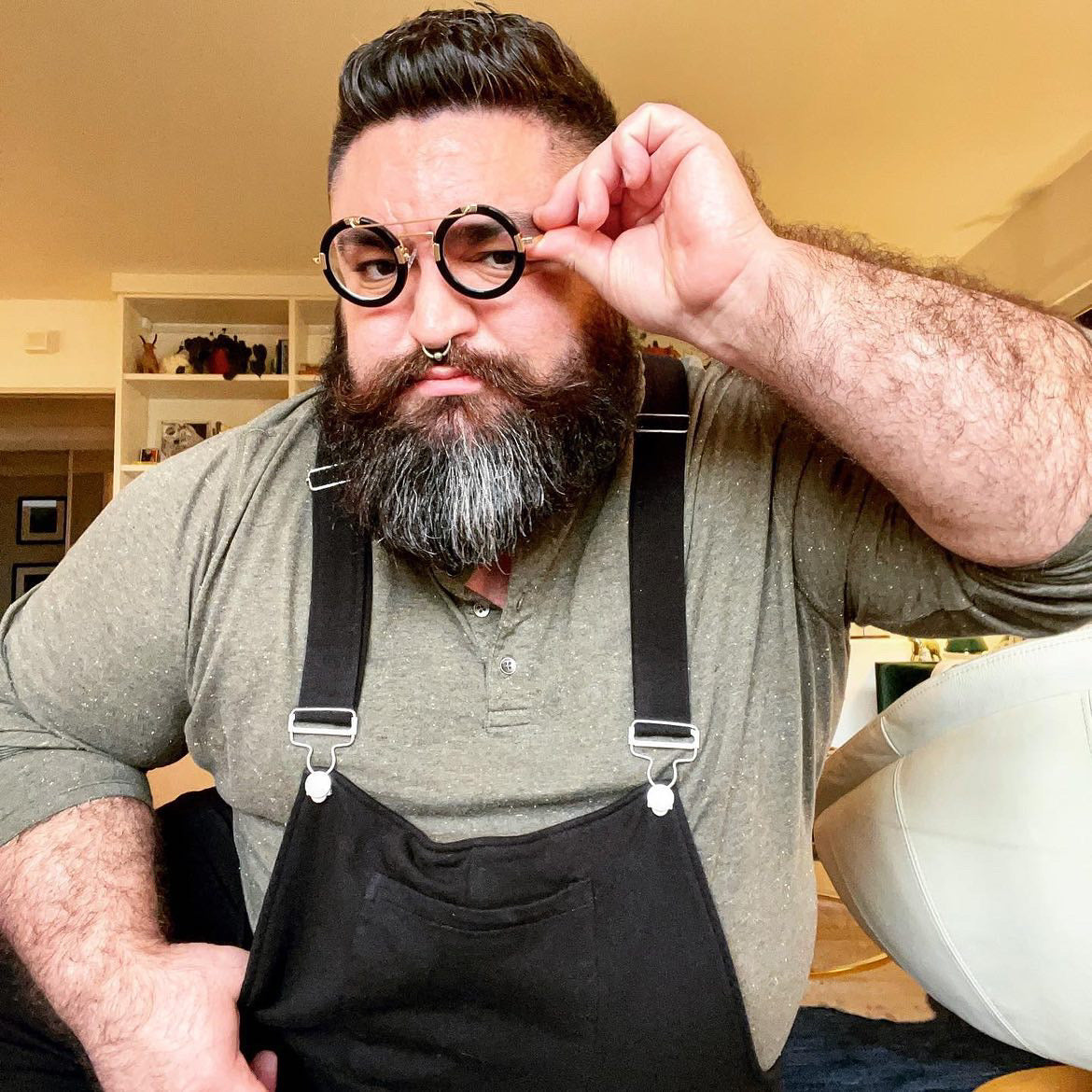 Ben Cuevas adjusting glasses, Swoveralls straps and bib visible