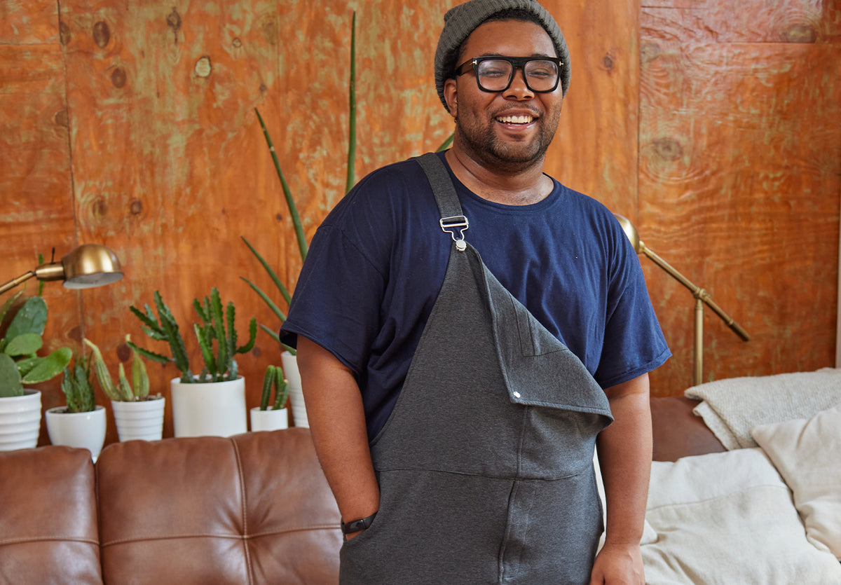 Person smiling in Dark Athletic Grey Swoveralls