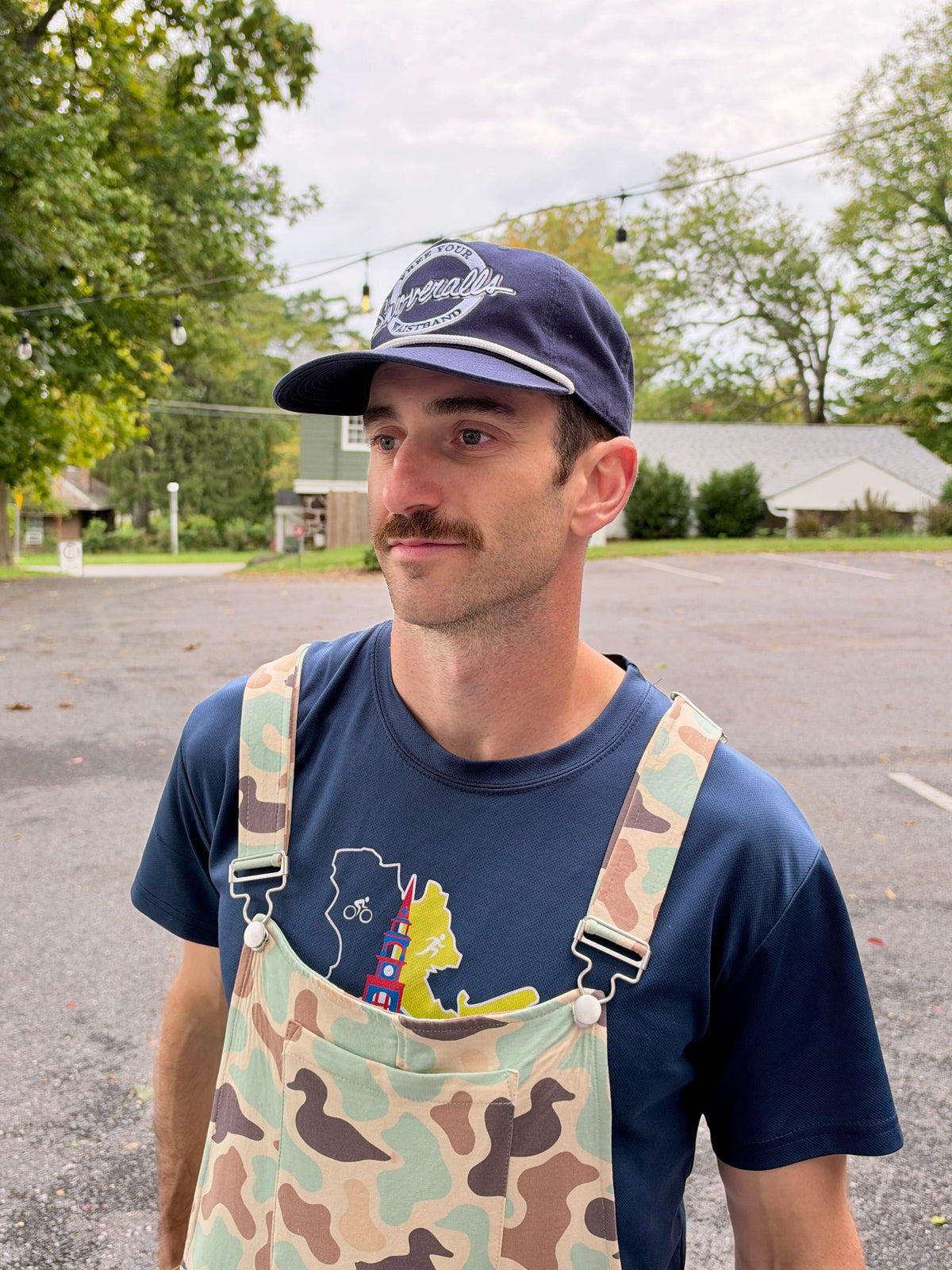 Navy rope cap with a circular Free Your Waistband Swoveralls patch