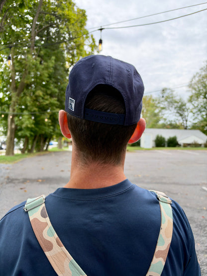 Back of the navy Free Your Waistband rope cap with snapback strap