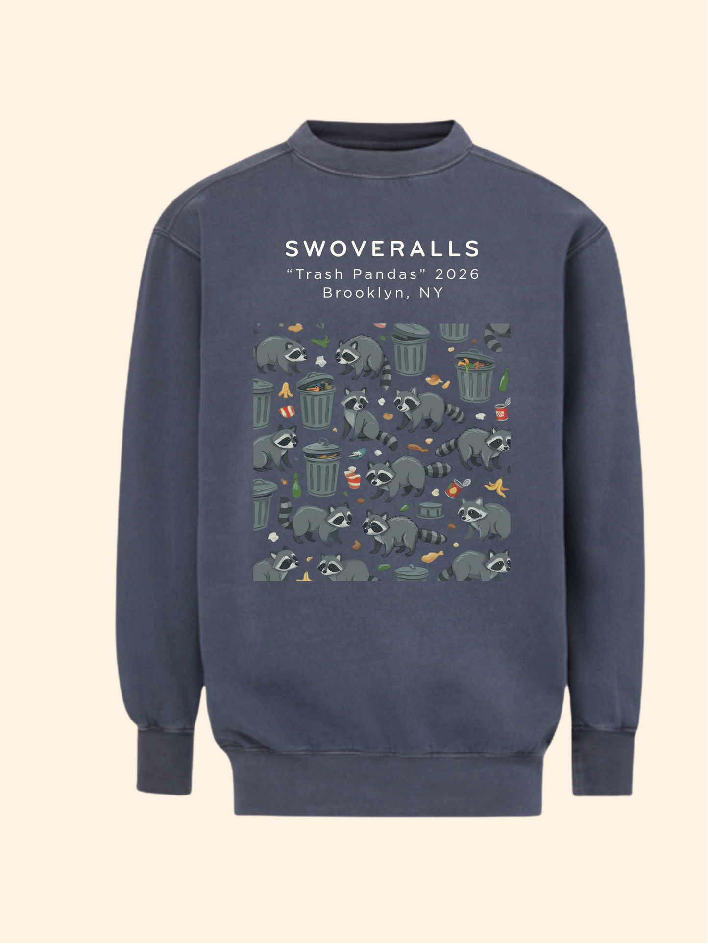 A navy blue crewneck sweatshirt featuring a graphic print of raccoons in trash cans with the text 'SWOVERALLS "Trash Pandas" 2026 Brooklyn, NY' on the chest, displayed against a solid cream background.