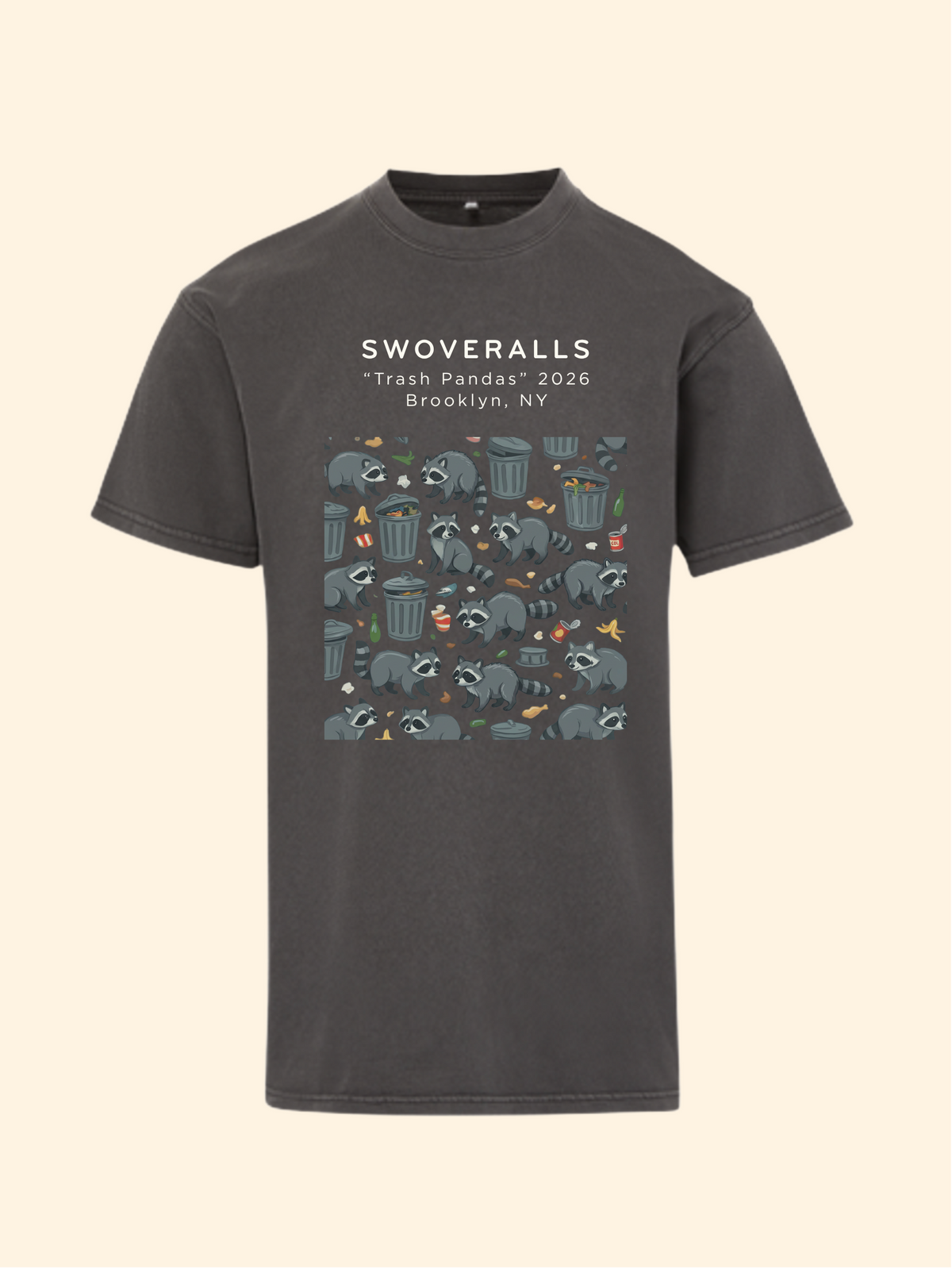 A dark charcoal gray t-shirt with a graphic print on the front. The print features the text 'SWOVERALLS Trash Pandas 2026 Brooklyn, NY' above a pattern of raccoons in a trash can with small colorful details.