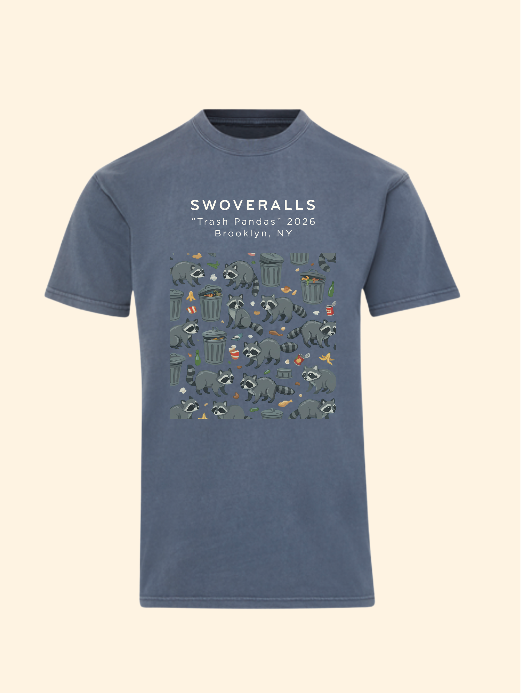 A slate blue crewneck t-shirt featuring a graphic print of trash pandas and recycling symbols with the text 'SWOVERALLS "Trash Pandas" 2026 Brooklyn, NY' on the chest, displayed against a solid cream background.