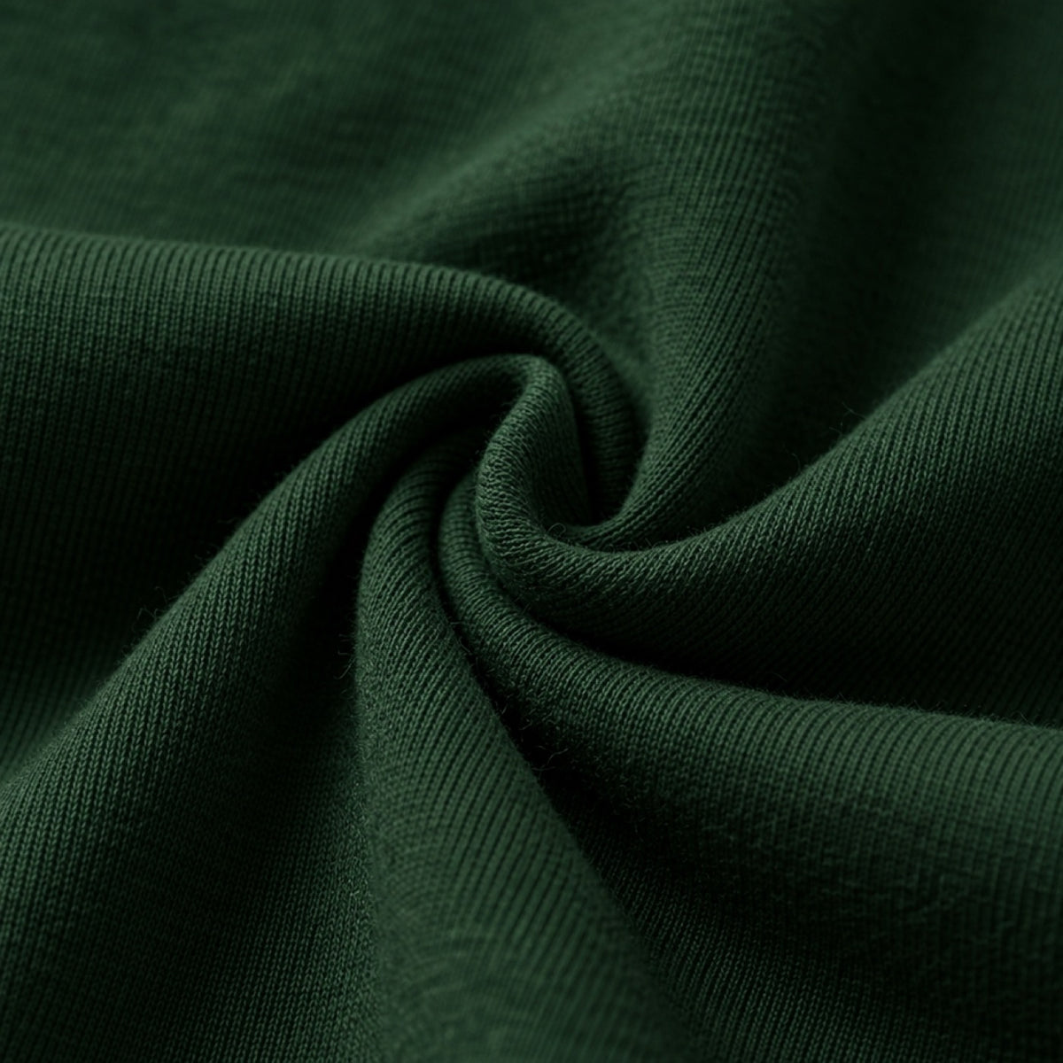 Close-up of Swoveralls french terry fabric in forest green
