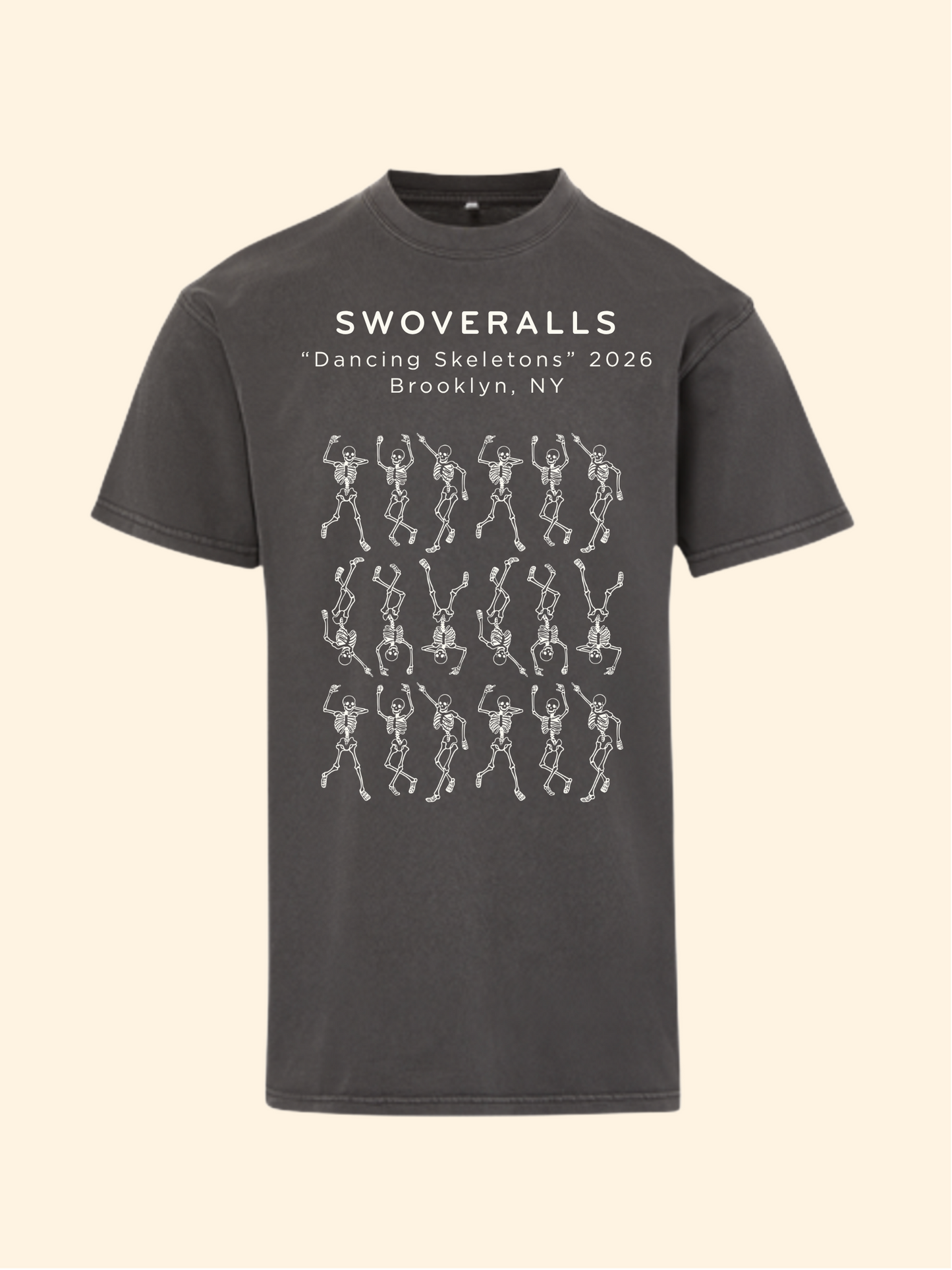 A dark charcoal gray t-shirt with a graphic print on the front. The print features the text 'SWOVERALLS Trash Pandas 2026 Brooklyn, NY' above a pattern of raccoons in a trash can with small colorful details.